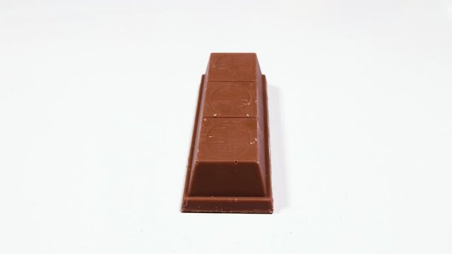 slicing kit kat on isolated background. animation shows inside of Chocolate bar with caramel 4K