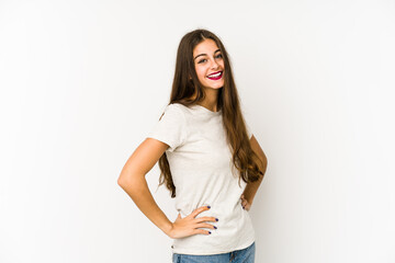 Fototapeta premium Young caucasian woman isolated on white background confident keeping hands on hips.