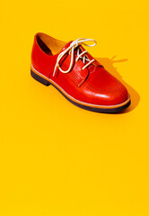 Vintage stylish shoes in isometric on yellow background. Minimal fashion concept