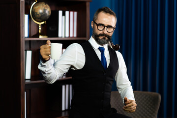 Portrait of happy mature businessman bearded wearing glasses and suite on dark background