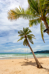 Exotic tropical paradise swings over crystal clear turquoise blue ocean sea water landscape seascape at Patong Beach, Phuket, Thailand