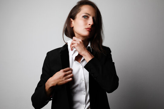 Headshot Portrait Of Young Business Woman Posing Isolated Over Grey Wall Background. Space For Text.