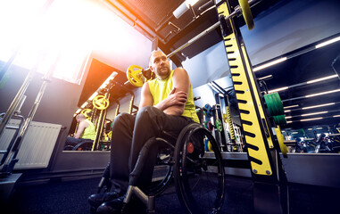 Fototapeta premium Disabled man training in the gym of rehabilitation center