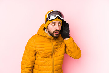 Young skier man isolated trying to listening a gossip.