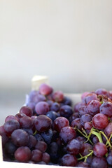 Crate of red grapes. Selective focus.