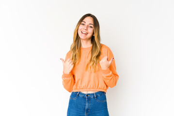 Fototapeta premium Young caucasian woman isolated on white background raising both thumbs up, smiling and confident.