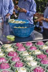 lotus flower offerings in Erawan Museum temple in Bangkok, Thailand