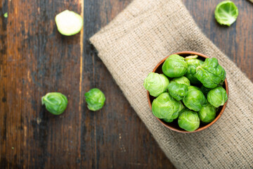 fresh raw brussels sprouts on a wooden table