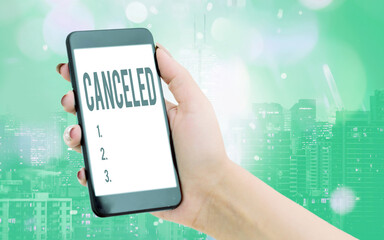 Writing note showing Canceled. Business concept for to decide not to conduct or perform something planned or expected Modern gadgets white screen under colorful bokeh background - obrazy, fototapety, plakaty