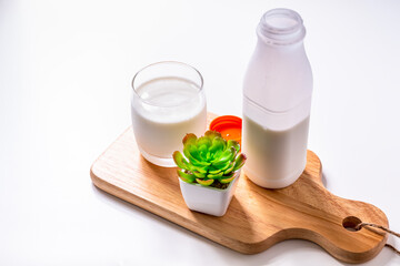 Glass of Milk with bottle on white background