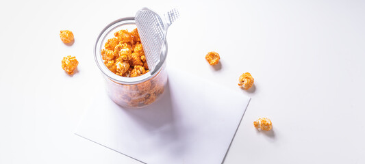 Box of salty popcorn on white background