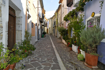 A narrow street among the old houses of Baselice, a small town in the province of Benevento, Italy.