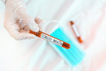 Text sign showing Technology Innovation. Business photo showcasing significant technological changes of products Extracted blood sample vial ready for medical diagnostic examination