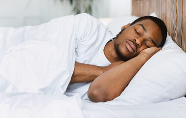 African American Guy Sleeping Resting In His Bed At Home