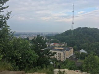 City of Lviv in Ukraine on cloudy summer morning with tower on mountain