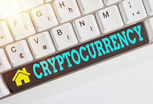 Text sign showing Cryptocurrency. Business photo showcasing form of currency that exists digitally has no central issuing Different colored keyboard key with accessories arranged on empty copy space