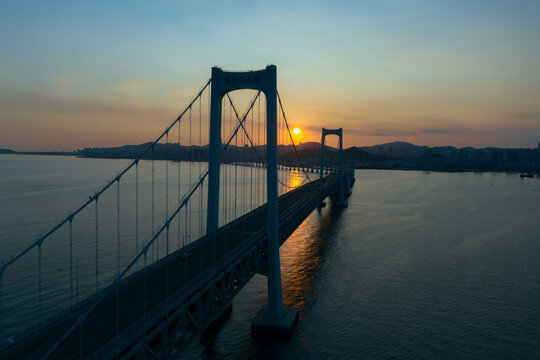 Aerial photo of the cross sea bridge at sunset was taken in Dalian, Liaoning Province, China
