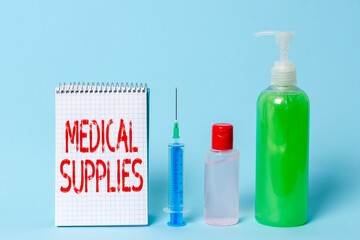 Handwriting text Medical Supplies. Conceptual photo Items necessary for treatment of illness or injury Set of medical equipment with notepad for health condition assessment