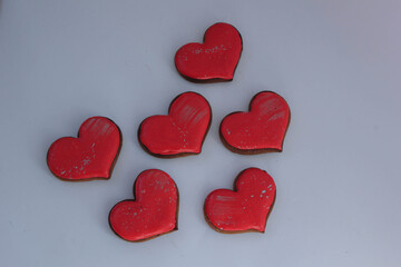 heart shaped candles. heart shaped chocolates. heart shaped cake 
