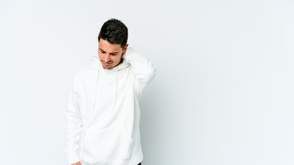 Young caucasian man isolated on white background suffering neck pain due to sedentary lifestyle.