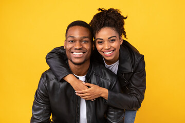 Lovely African American Couple Hugging Posing In Studio, Yellow Background