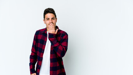Obraz premium Young caucasian man isolated on white background shocked, covering mouth with hands, anxious to discover something new.