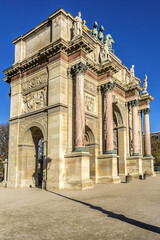 Triumphal Arch (Arc de Triomphe du Carrousel) at Tuileries gardens in Paris, France. Monument built in 1806 - 1808 to commemorate Napoleon's military victories.
