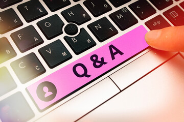 Conceptual hand writing showing Q And A. Concept meaning a period of time or an occasion when someone answers questions Colored PC keyboard key With Accessories on Empty background