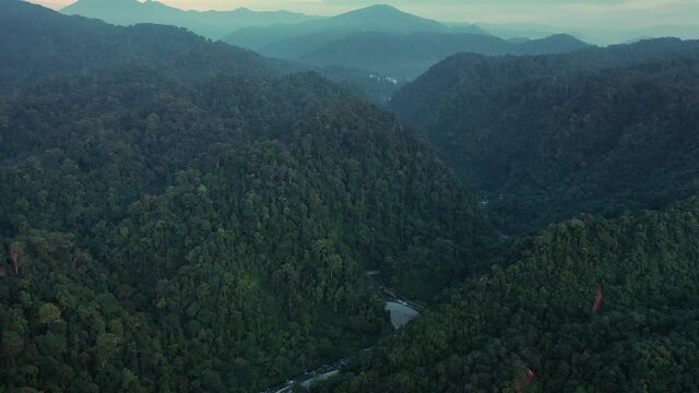 Moody cinematic aerial view of rainforest scenery from Bukit Lawang at dawn in Gunung Leuser National Park, the Tropical Rainforest Heritage of Sumatra, Indonesia
