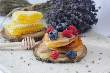 Pancakes with honey and berries. blueberry pie with blueberries. Pancakes with chocolate and berries