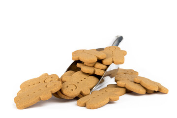 a silver scoop of gingerbread men cookies isolated on white 
