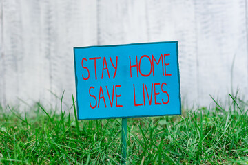 Conceptual hand writing showing Stay Home Save Lives. Concept meaning lessen the number of infected...