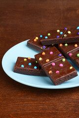 chocolate fudge brownies on a blue plate