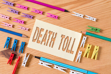 Handwriting text Death Toll. Conceptual photo the number of deaths resulting from a particular...