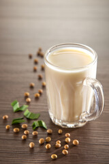 Homemade Soy milk and Soybean on wooden background, Healthy drink.