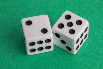 
9175	lucky seven - a pair of dice on a green background showing two and five
