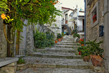 Fototapeta na wymiar A narrow street among the old houses of San Marco dei Cavoti, a small town in the province of Benevento, Italy.
