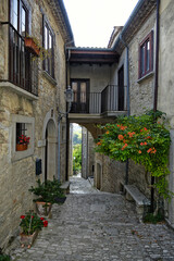 A narrow street among the old houses of San Marco dei Cavoti, a small town in the province of Benevento, Italy.