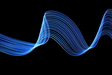 Long exposure photograph of neon blue colour in an abstract swirl, parallel lines pattern against a...