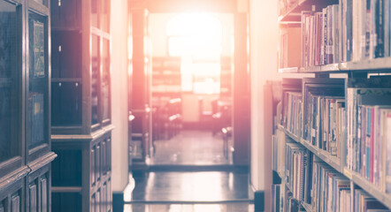 Book in library in old bookshelve with literature textbook and   aisle corridor in school or university. Academic education background concept...