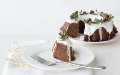 Christmas cupcake chocolate with white butter cream red cranberry berries on a red background,...