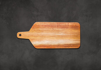 Wooden cutting board isolated on concrete background