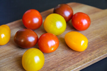 Cocktail tomatoes on a cutting board