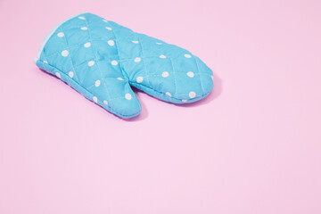 Oven glove on isolated pink background