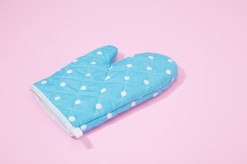 Oven glove on isolated pink background