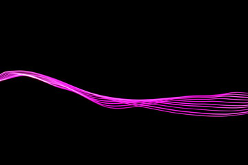 Long exposure photograph of neon pink colour in an abstract swirl, parallel lines pattern against a black background. Light painting photography.