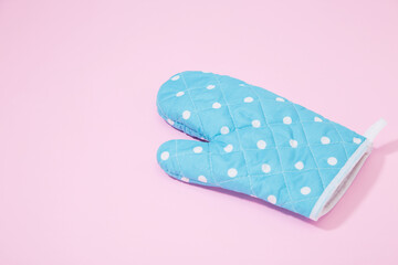 Oven glove on isolated pink background