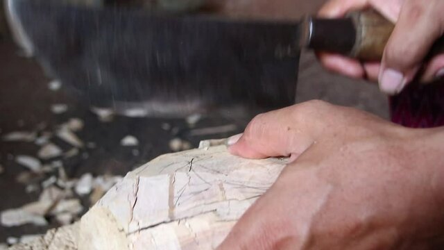 the process of making traditional wooden puppet shows from wood, with a focused selection. Photographed in low light and noise video