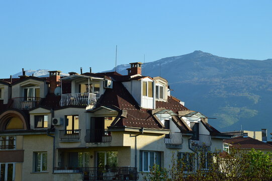 A picture of a house in Sofia, Bulgaria with mountain Vitosha in the background.