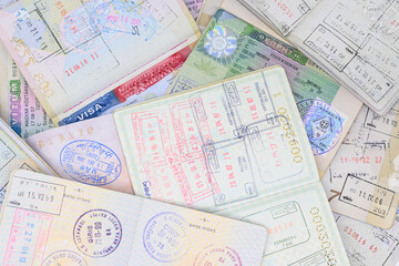 Pages of passports with different stamps and visas.